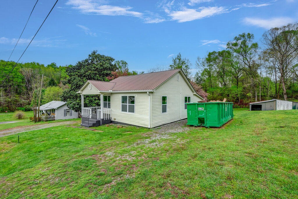183 Earl Ezell Road Spring City, TN 37381 - Photo 24 of 30 a view of a house with a yard and sitting area