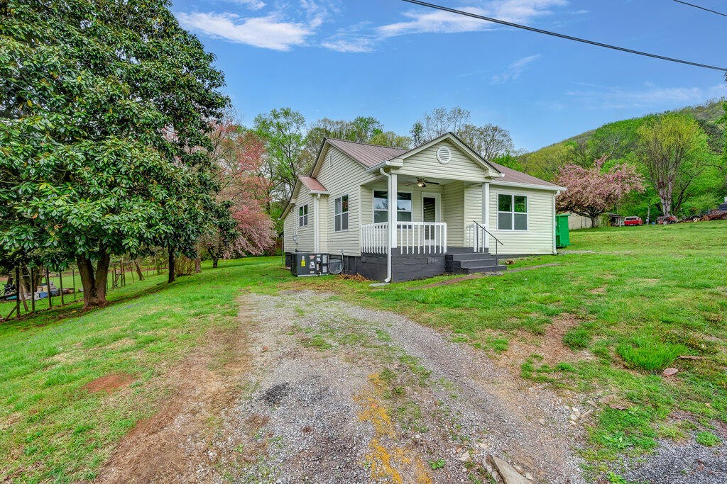 183 Earl Ezell Road Spring City, TN 37381 - Photo 27 of 30 a front view of a house with garden