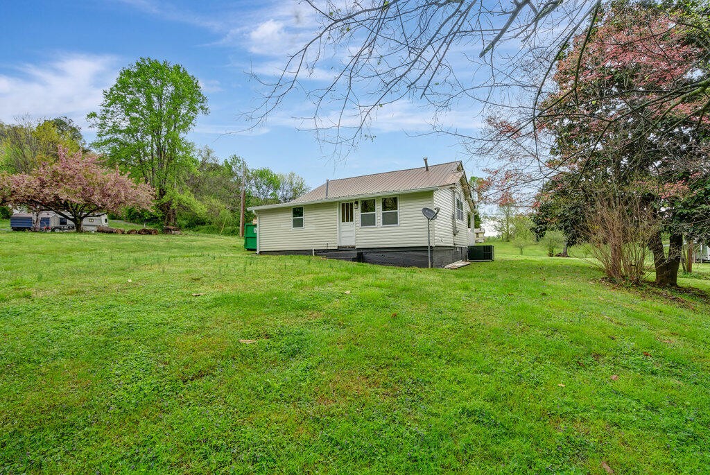 183 Earl Ezell Road Spring City, TN 37381 - Photo 28 of 30 a view of a house with a backyard