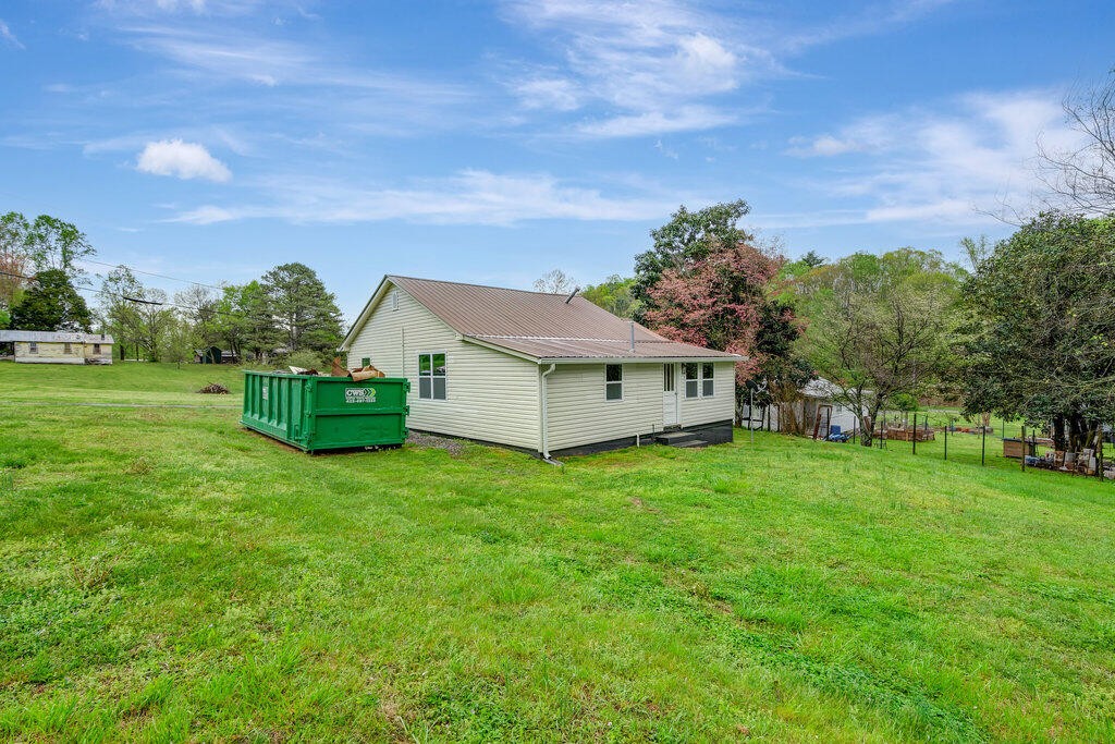183 Earl Ezell Road Spring City, TN 37381 - Photo 29 of 30 a view of a house with backyard and garden