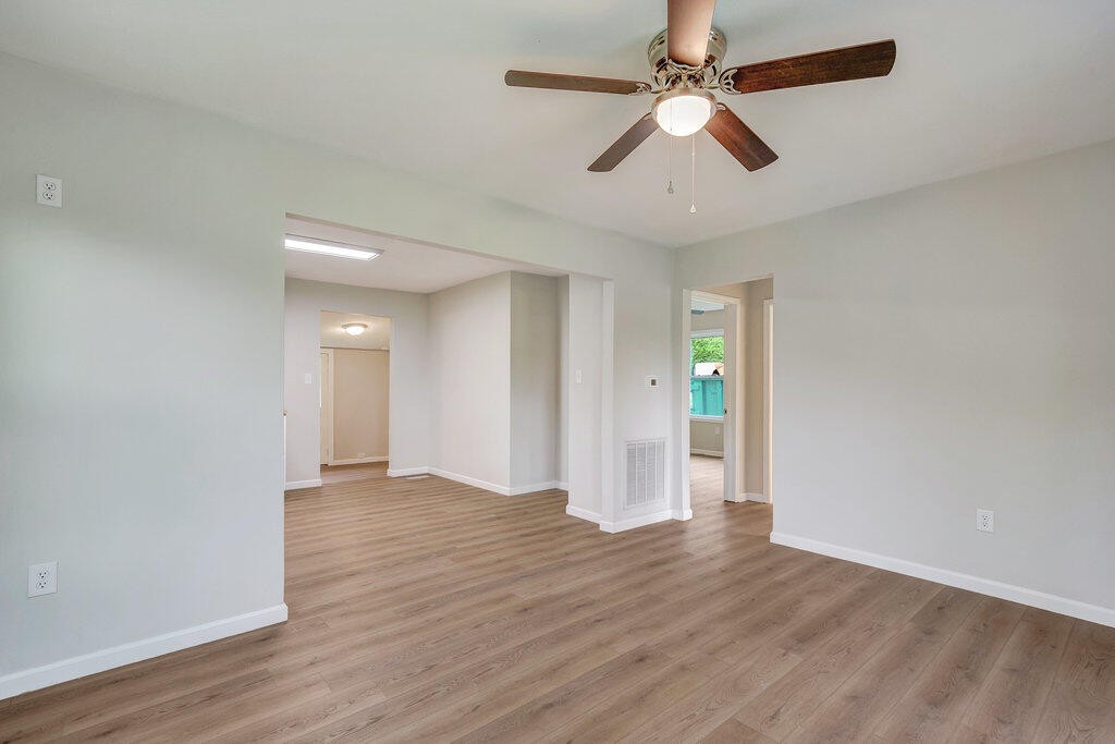 183 Earl Ezell Road Spring City, TN 37381 - Photo 7 of 30 wooden floor in an empty room with a window