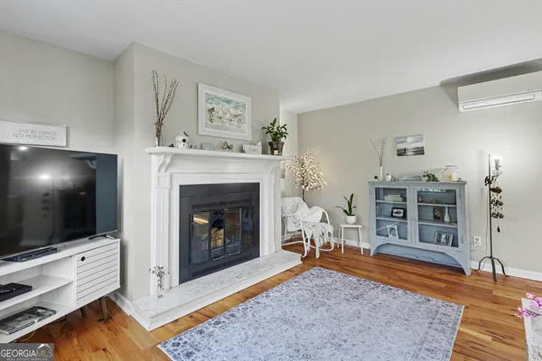 a living room with furniture and a rug