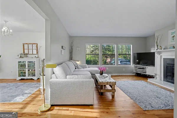 a view of a dining room with furniture window and wooden floor