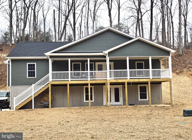a house with trees in the background