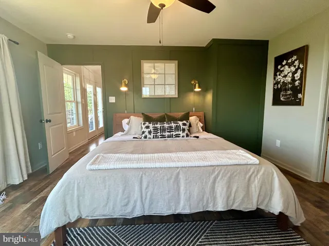 a bedroom with a large bed and a window