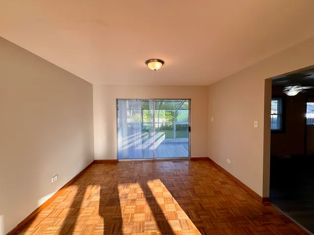 a view of hallway with wooden floor