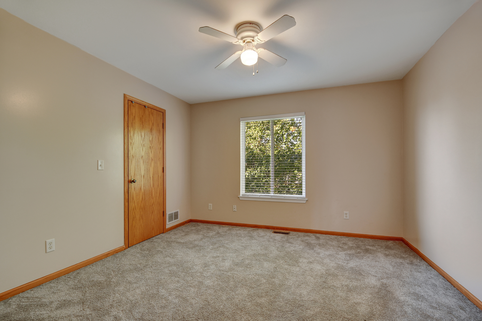 428 Rachel Circle Romeoville, IL 60446 - Photo 22 of 26 an empty room with a window and a fan