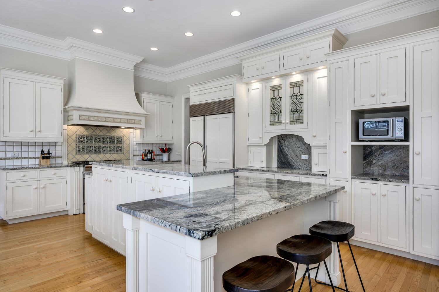 1833 North Howe Street Chicago, IL 60614 - Photo 11 of 41 a kitchen with granite countertop white cabinets and appliances