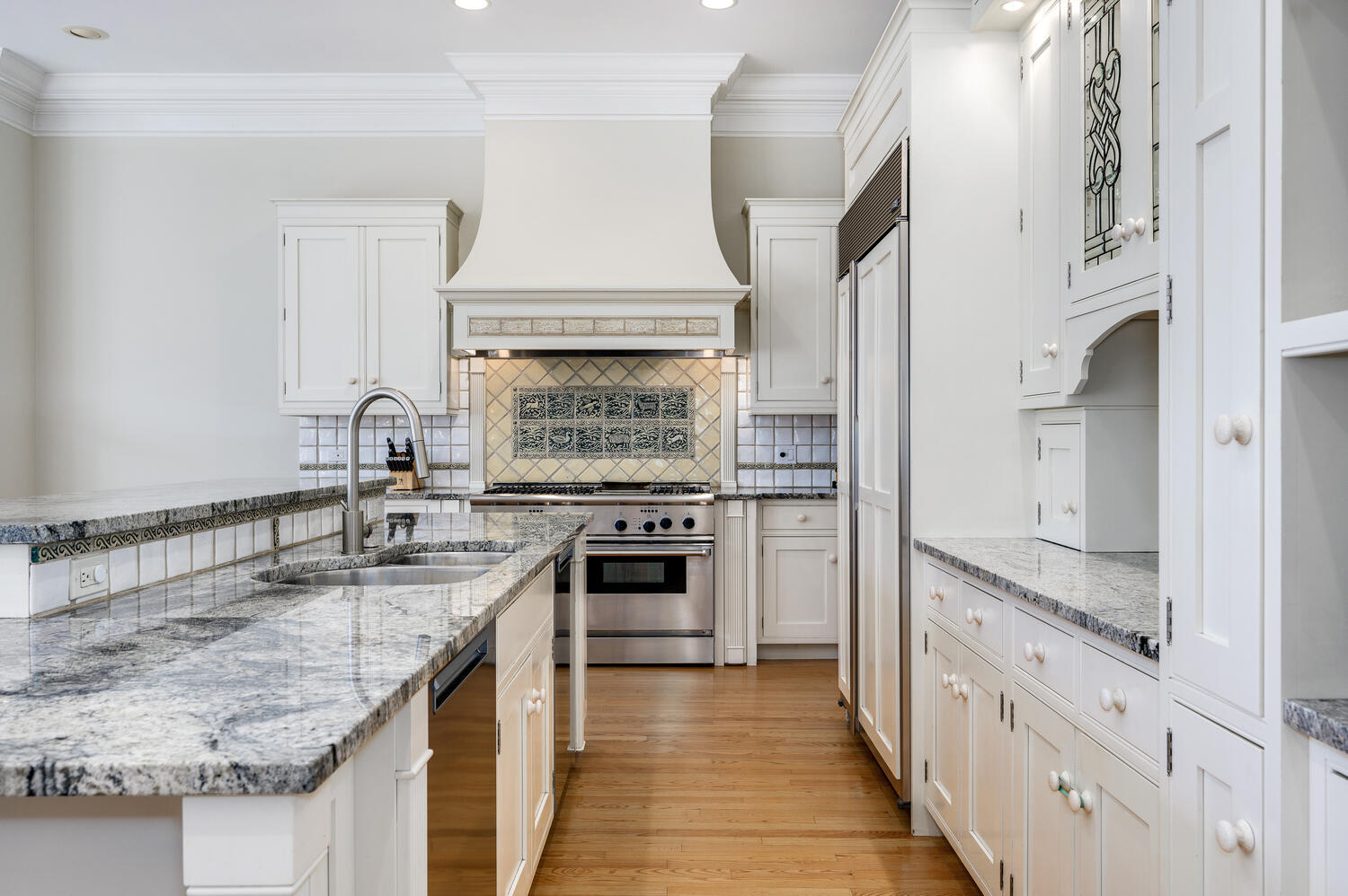 1833 North Howe Street Chicago, IL 60614 - Photo 13 of 41 a kitchen with granite countertop a sink stove and cabinets