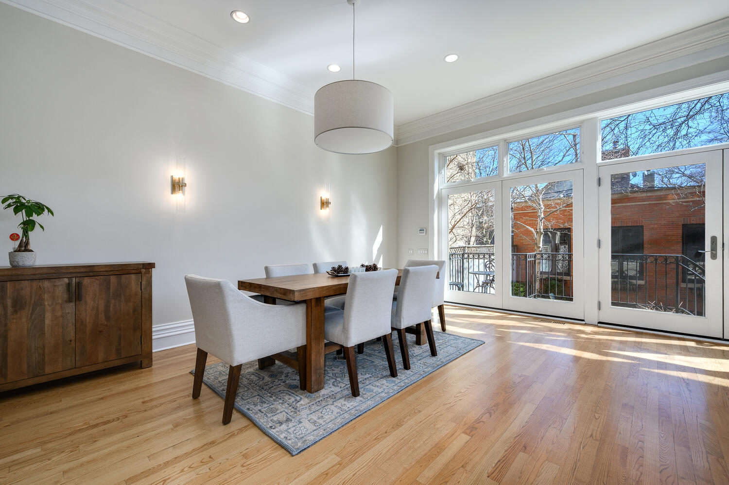 1833 North Howe Street Chicago, IL 60614 - Photo 14 of 41 a view of a dining room with furniture wooden floor and chandelier