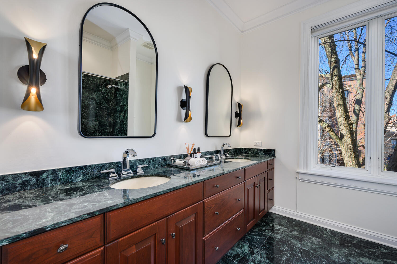 1833 North Howe Street Chicago, IL 60614 - Photo 25 of 41 a bathroom with a double vanity sink and a mirror