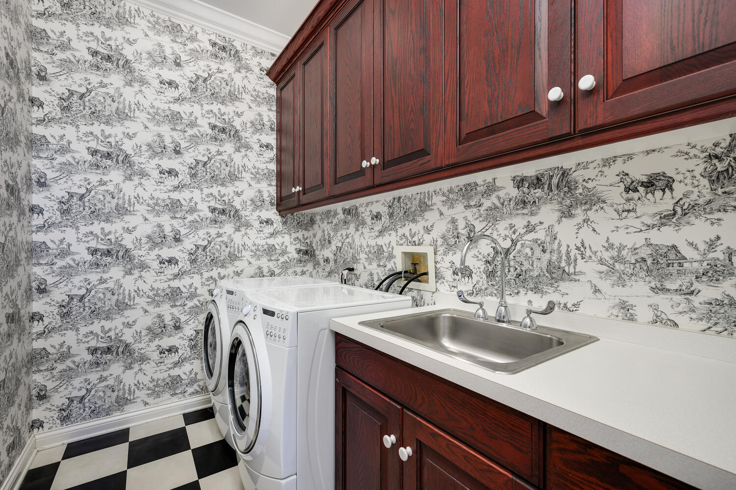 1833 North Howe Street Chicago, IL 60614 - Photo 29 of 41 a sink with wooden cabinets
