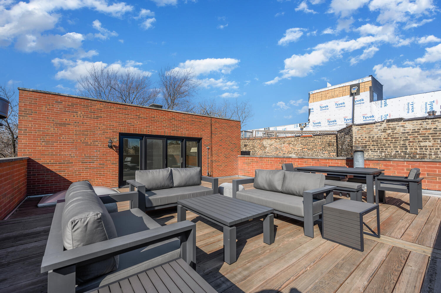 1833 North Howe Street Chicago, IL 60614 - Photo 30 of 41 a outdoor living space with furniture and a flat screen tv