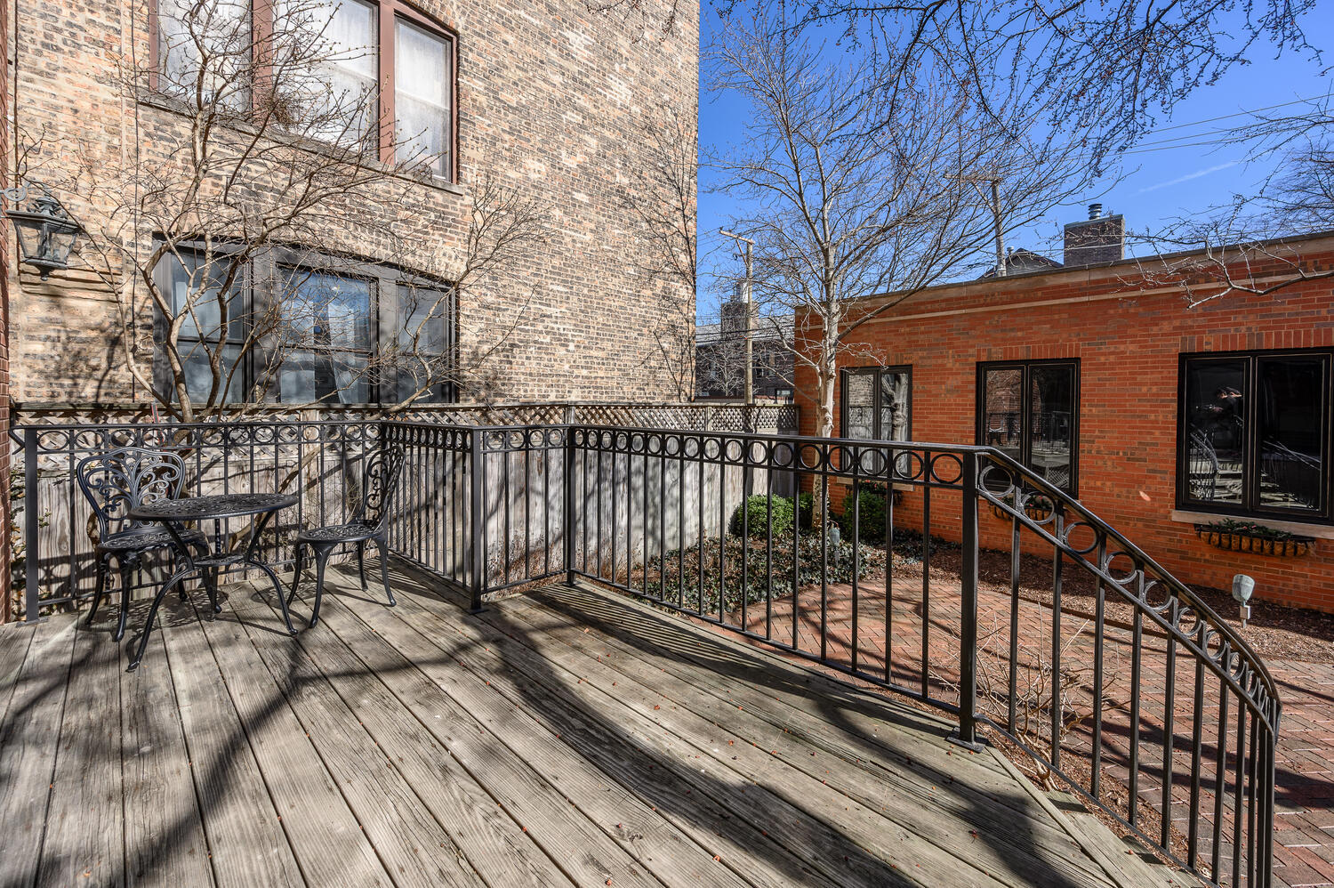1833 North Howe Street Chicago, IL 60614 - Photo 39 of 41 a view of a balcony with wooden floor and fence