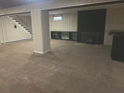 a front view of a house with yard and furniture