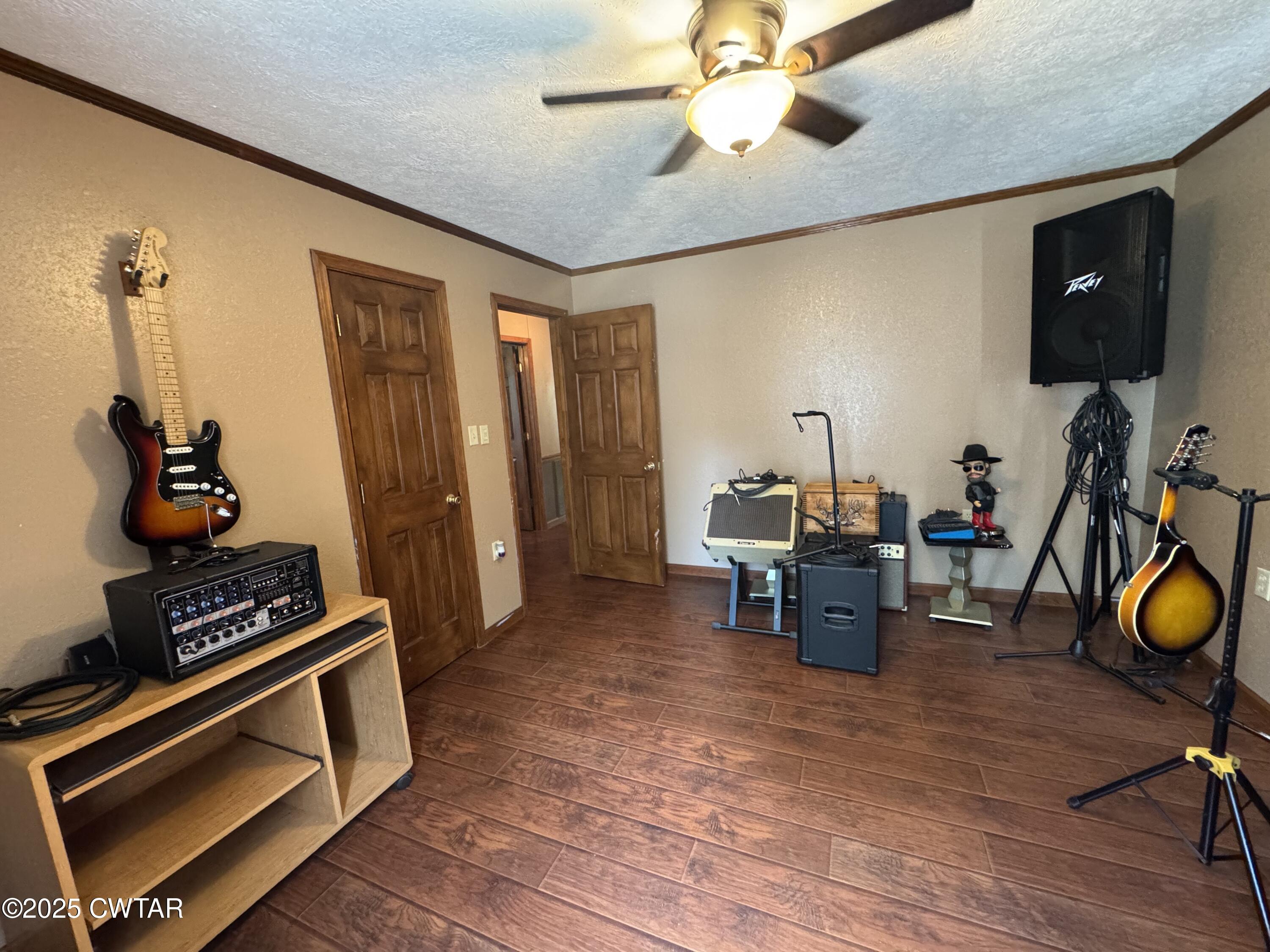1280 Mockingbird Road Medon, TN 38356 - Photo 7 of 14 a living room with furniture and a flat screen tv