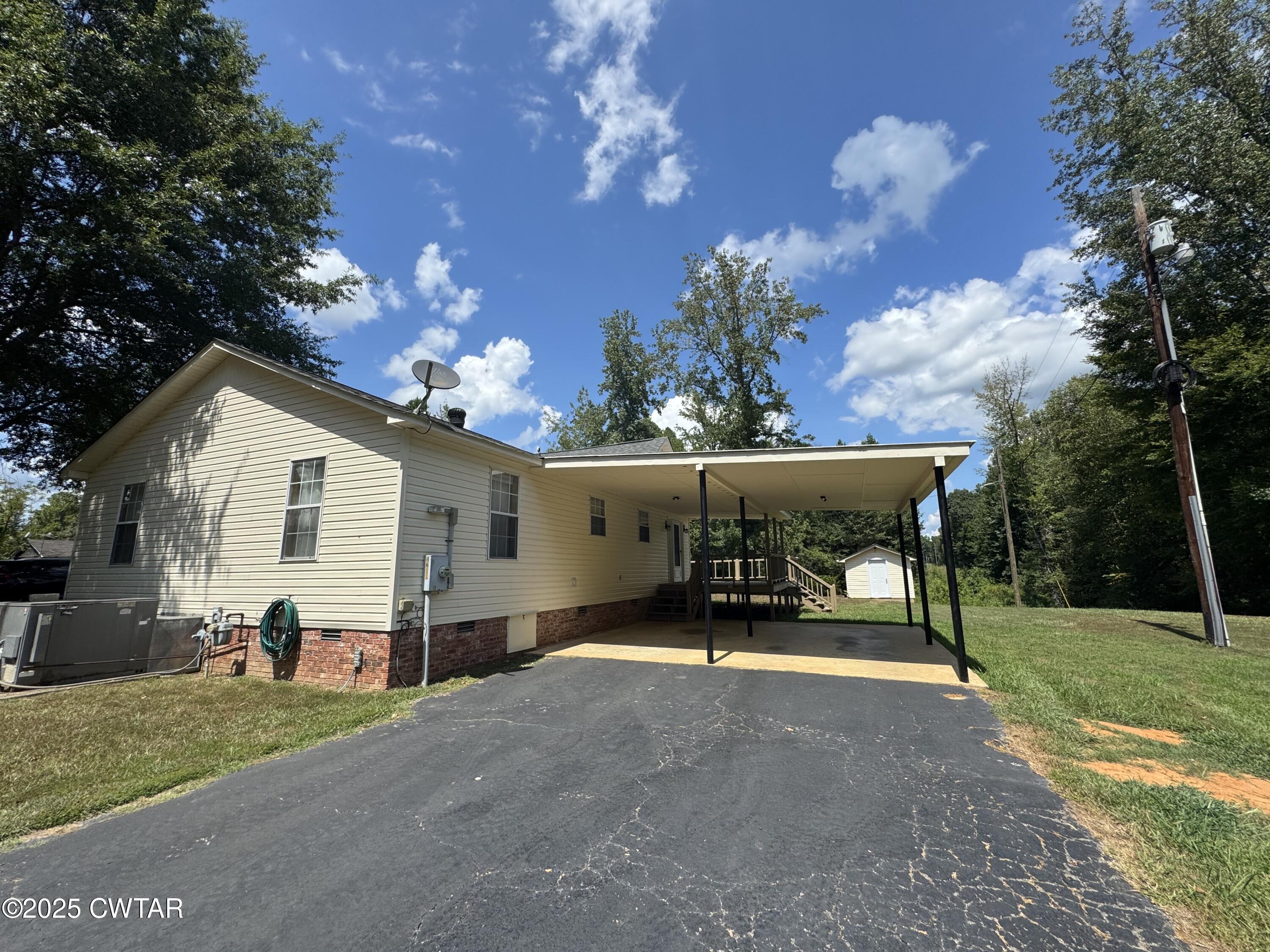 1280 Mockingbird Road Medon, TN 38356 - Photo 10 of 14 a view of a house with backyard and garden