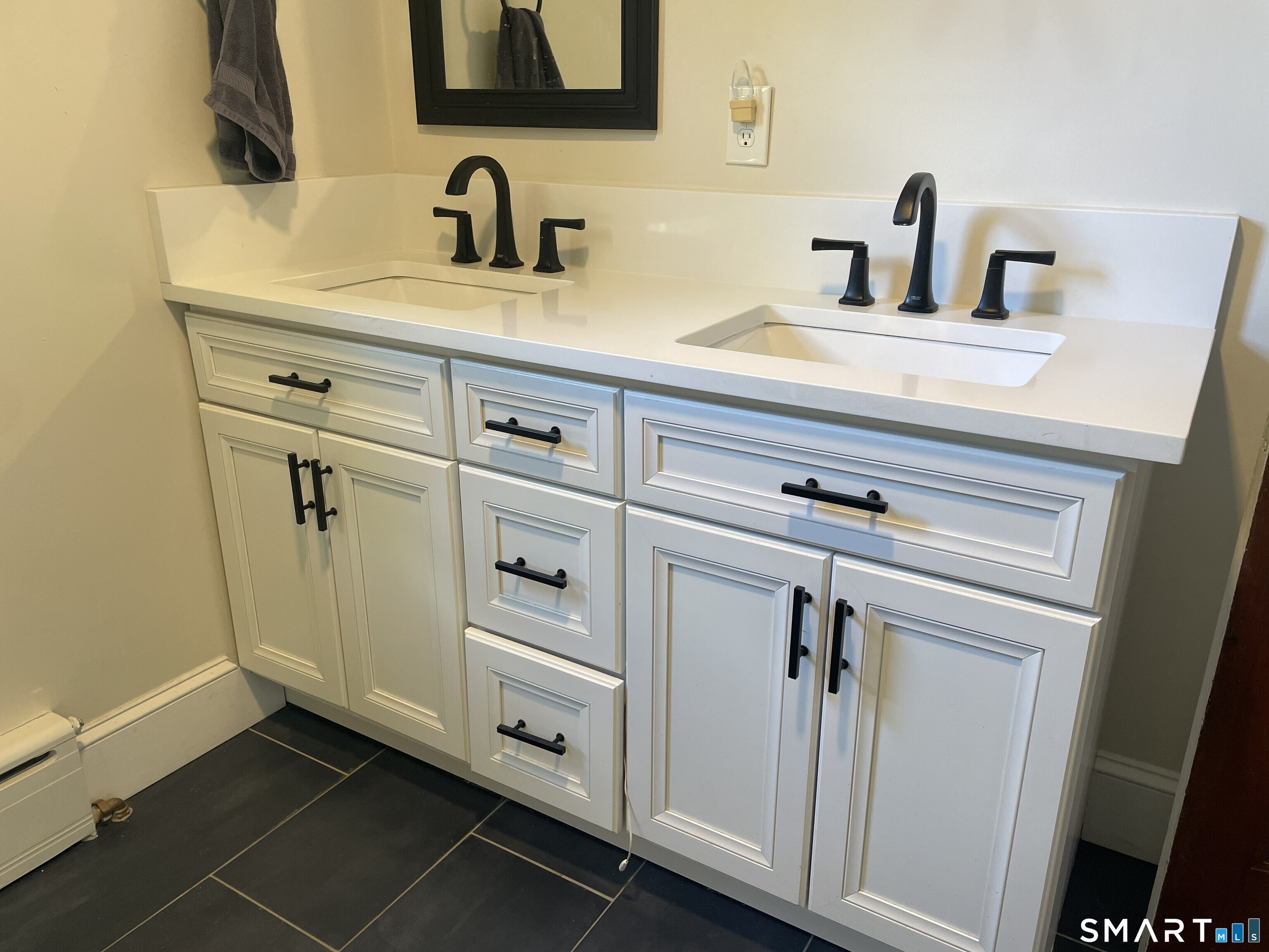 31 Elihu Street Hamden, CT 06517 - Photo 8 of 11 a bathroom with a sink and mirror