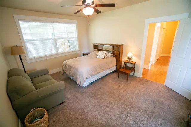 a bedroom with furniture and a window