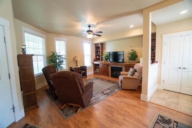 a living room with furniture and a chandelier