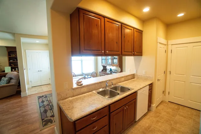 a kitchen with a sink and a refrigerator