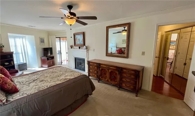 a living room with fireplace furniture and a flat screen tv