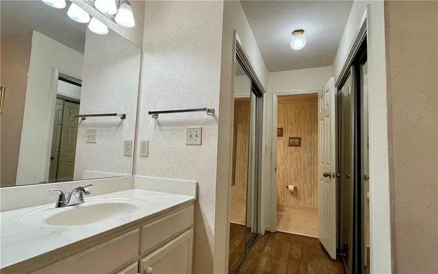 a bathroom with a sink and a mirror