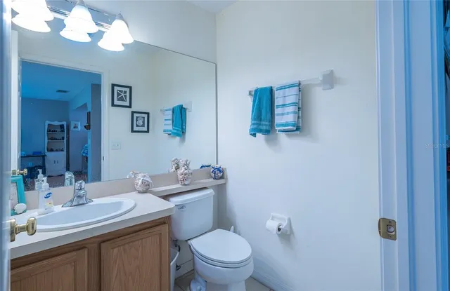 a bedroom with a bed and cabinets