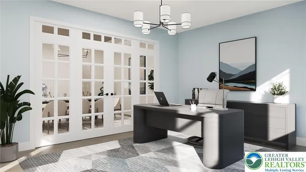 a living room with furniture a window and a potted plant
