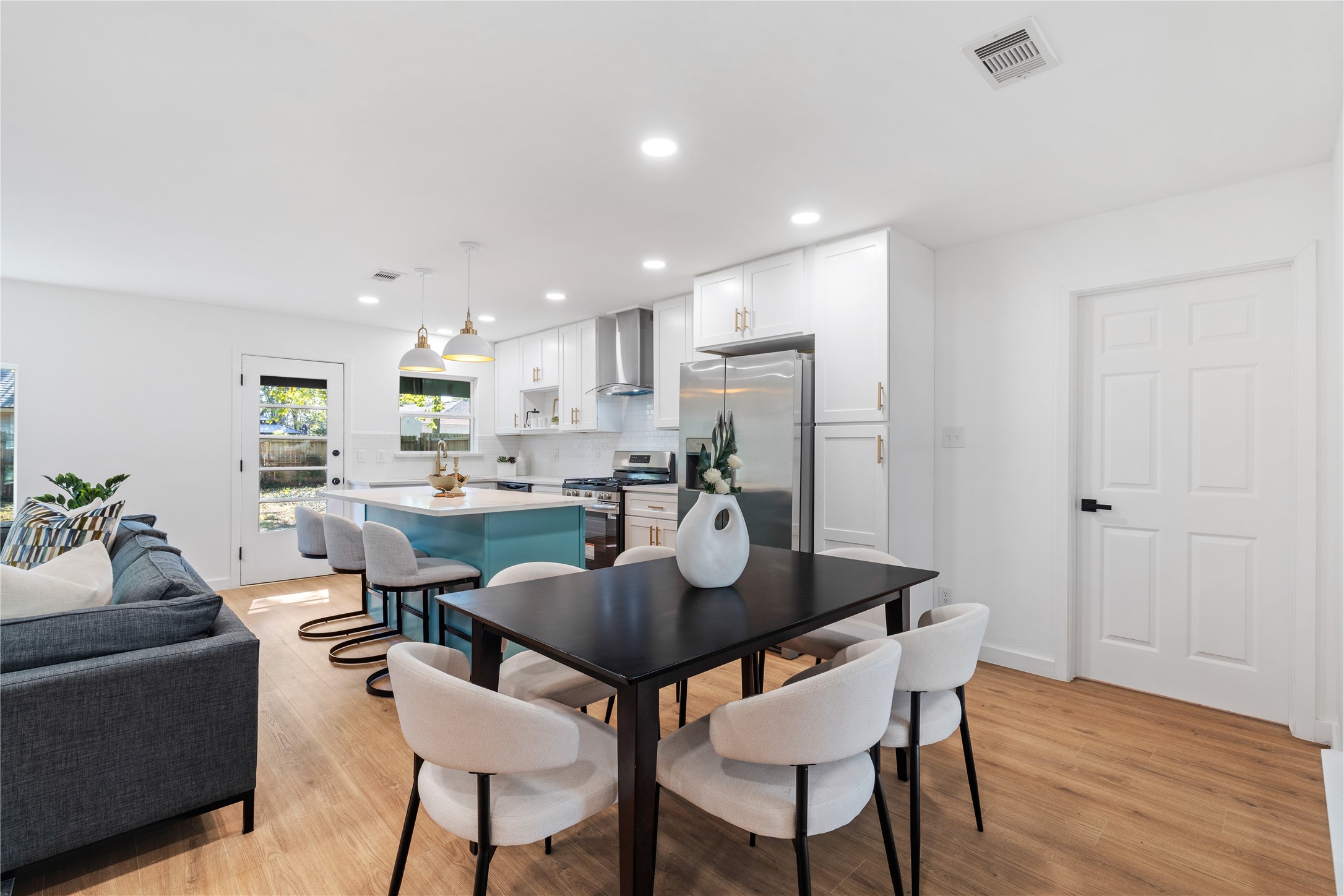 4427 Sanford Road Houston, TX 77035 - Photo 13 of 28 a dining room with furniture and wooden floor