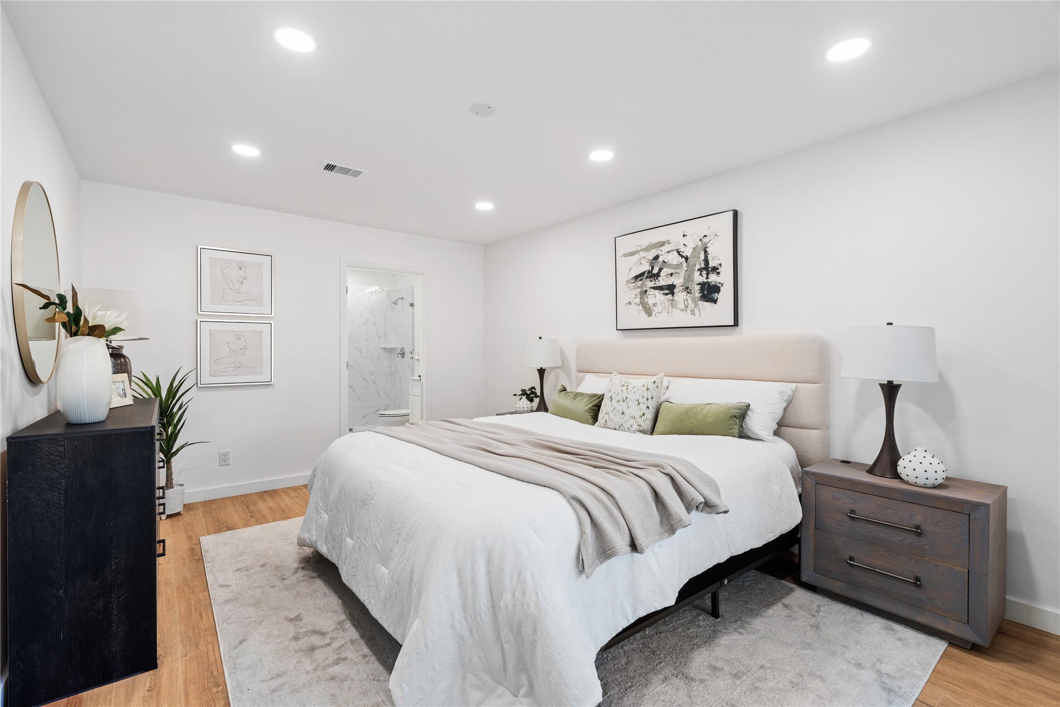 4427 Sanford Road Houston, TX 77035 - Photo 17 of 28 a spacious bedroom with a bed and a lamp