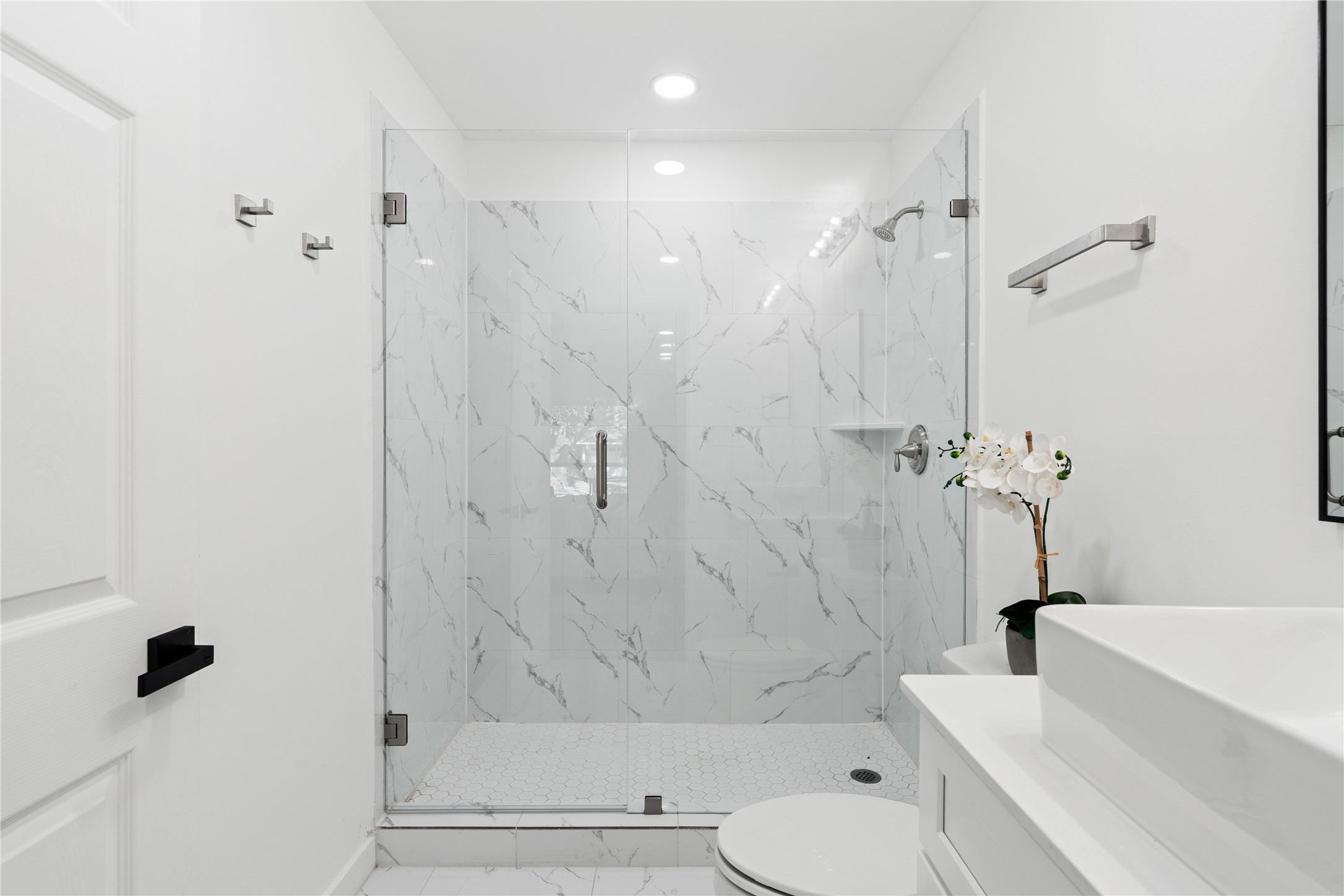 4427 Sanford Road Houston, TX 77035 - Photo 20 of 28 a bathroom with a bathtub shower sink vanity and toilet