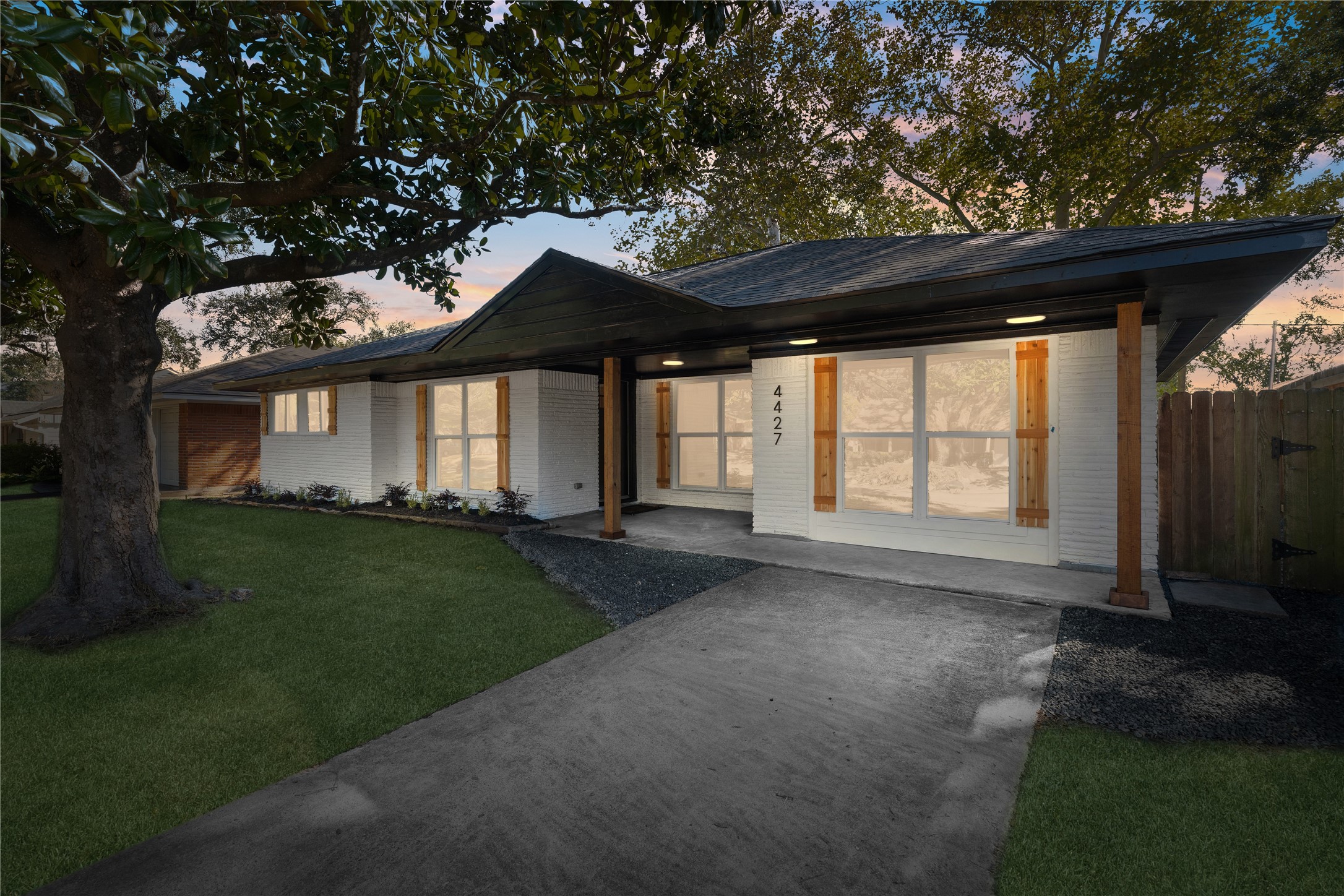 4427 Sanford Road Houston, TX 77035 - Photo 2 of 28 a view of a house with a large window and a yard