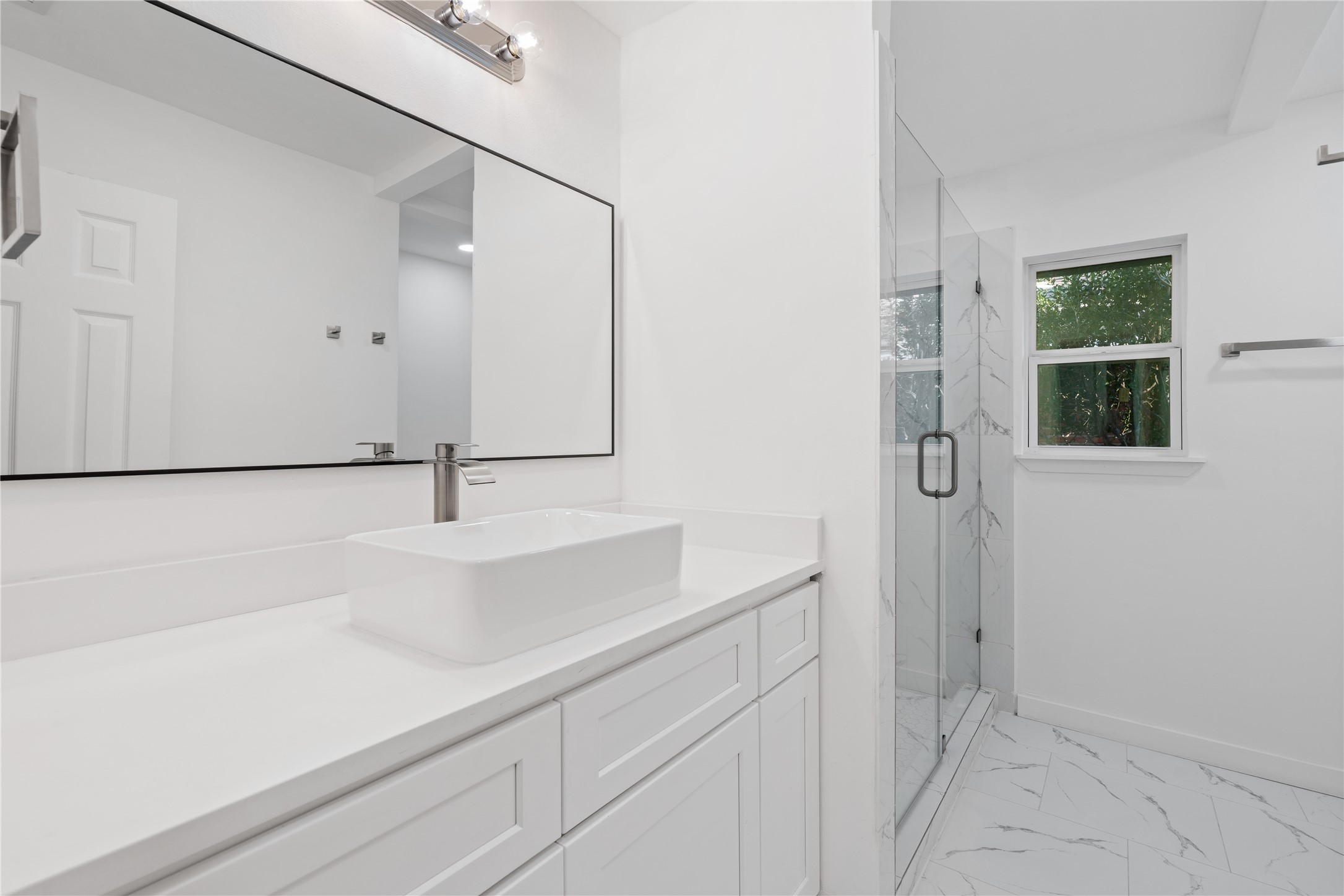 4427 Sanford Road Houston, TX 77035 - Photo 23 of 28 a bathroom with a sink and a mirror