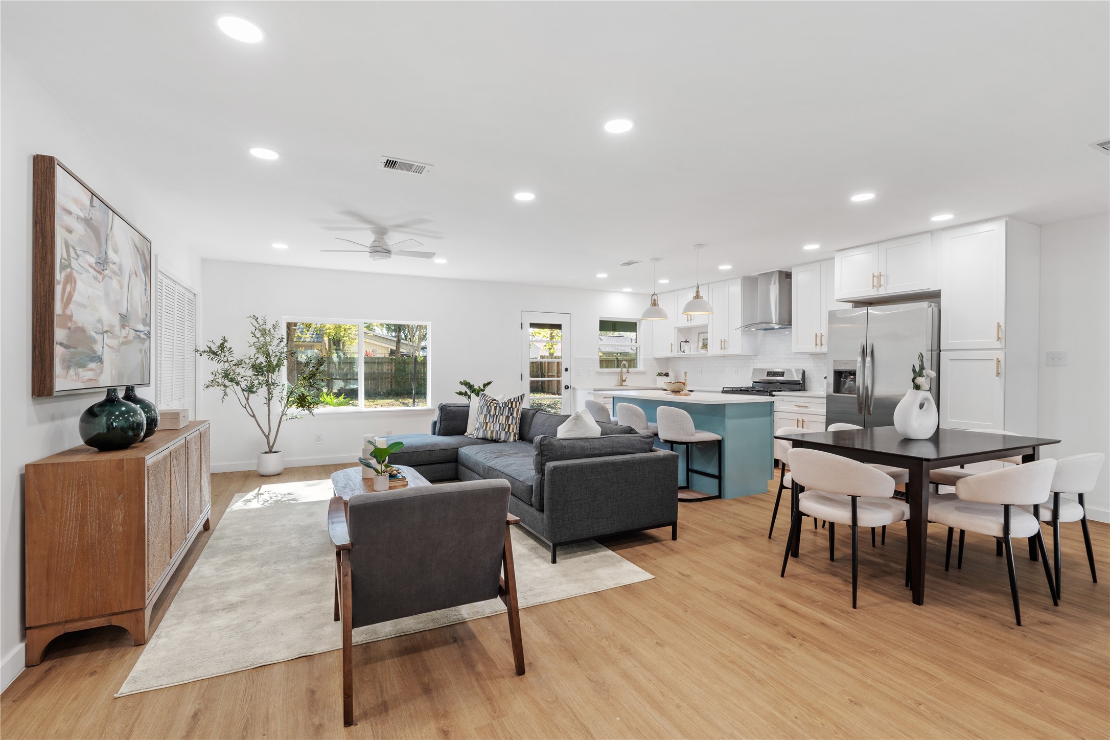 4427 Sanford Road Houston, TX 77035 - Photo 3 of 28 a living room kitchen with furniture and a wooden floor