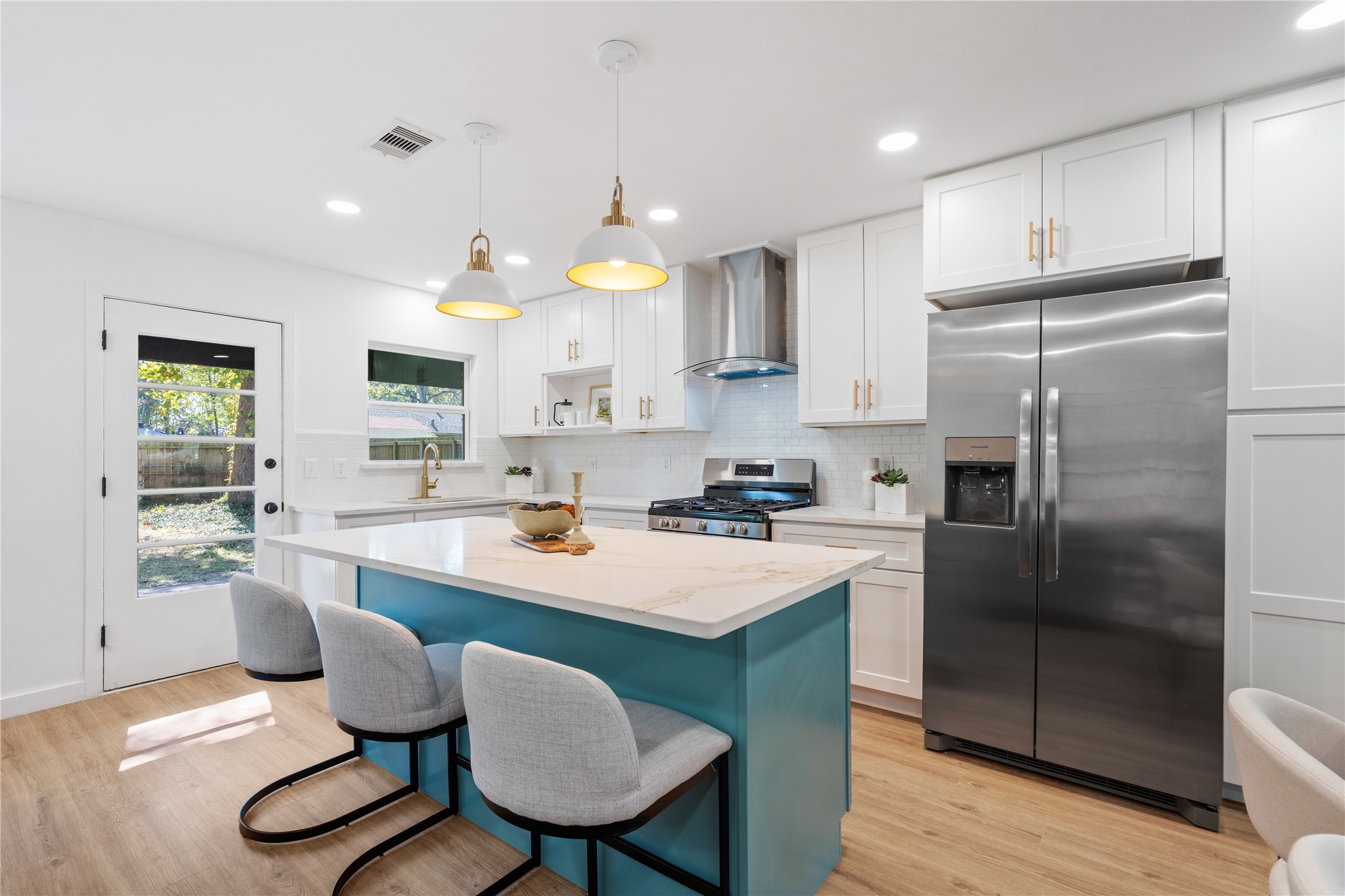 4427 Sanford Road Houston, TX 77035 - Photo 4 of 28 a kitchen with stainless steel appliances granite countertop a sink a stove a refrigerator cabinets and dining table