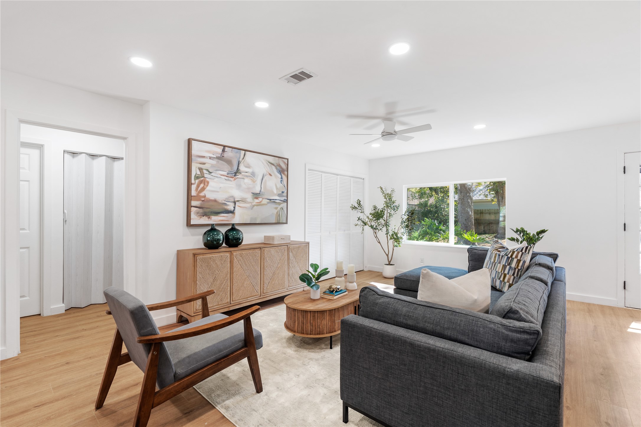 4427 Sanford Road Houston, TX 77035 - Photo 9 of 28 a living room with furniture and a potted plant