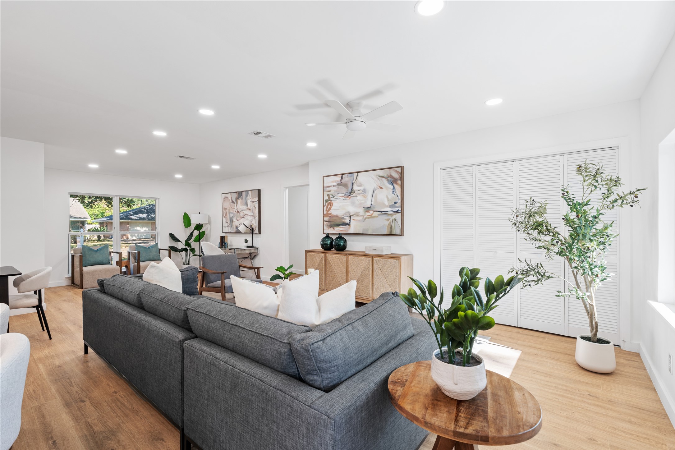 4427 Sanford Road Houston, TX 77035 - Photo 10 of 28 a living room with furniture potted plant and a couch