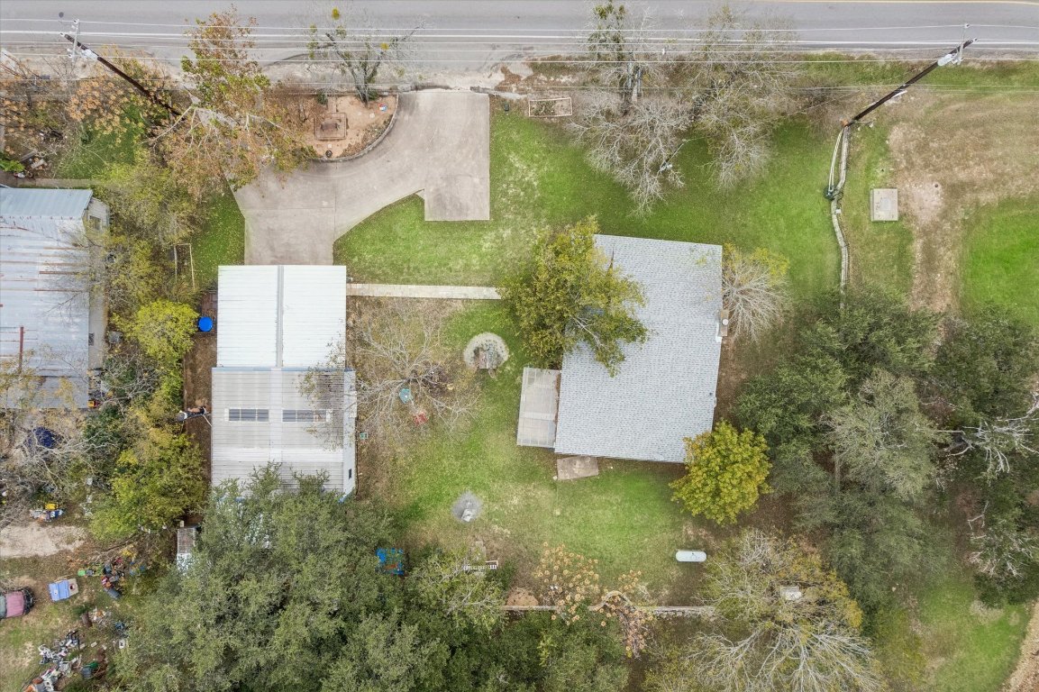 3502 1869th Ranch Liberty Hill, TX 78642 - Photo 2 of 18 an aerial view of residential houses with outdoor space and swimming pool