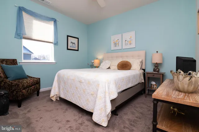 a bedroom with bed and a window