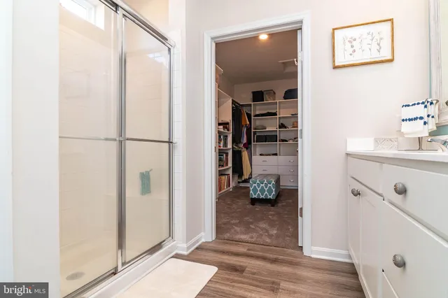 a view of a hallway with closet and a livingroom view