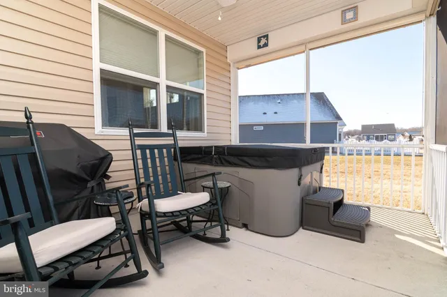 a balcony with table and chairs