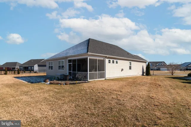 a front view of a house with yard and garage