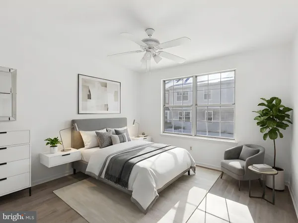 a bedroom with a large bed and a window