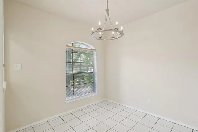a kitchen with appliances a sink and cabinets