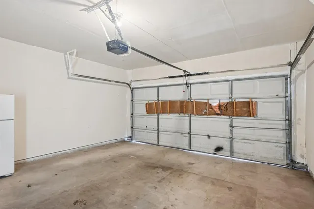 a view of backyard with a table and chairs and wooden floor