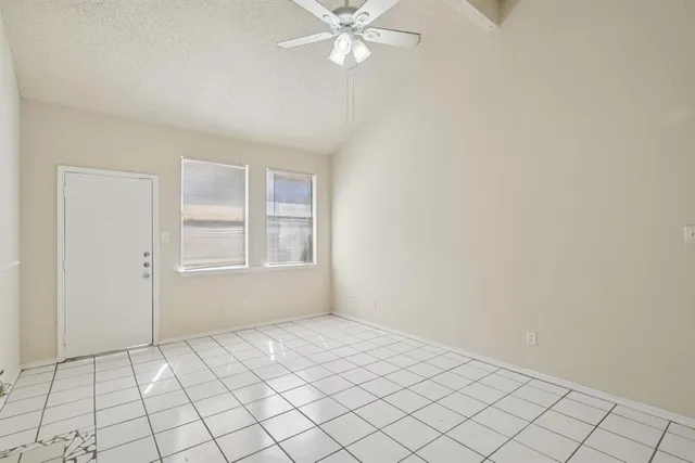 a view of a kitchen with a sink and refrigerator