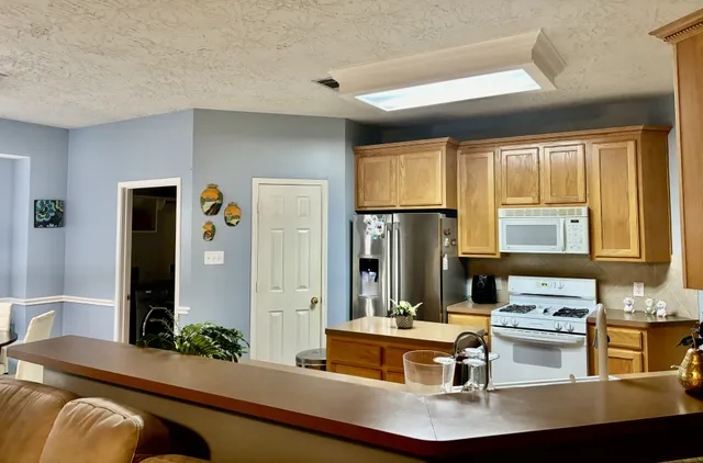 a living room with furniture and a table
