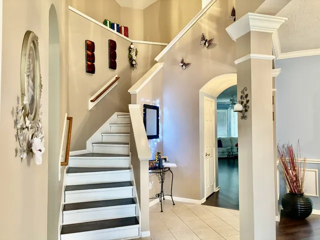 a view of entryway and hall with wooden floor