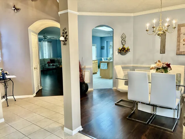 a view of a livingroom with furniture and a chandelier